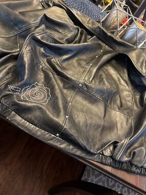 Women’s Black Leather Jacket with Studded Rose Accent & Concealed Carry